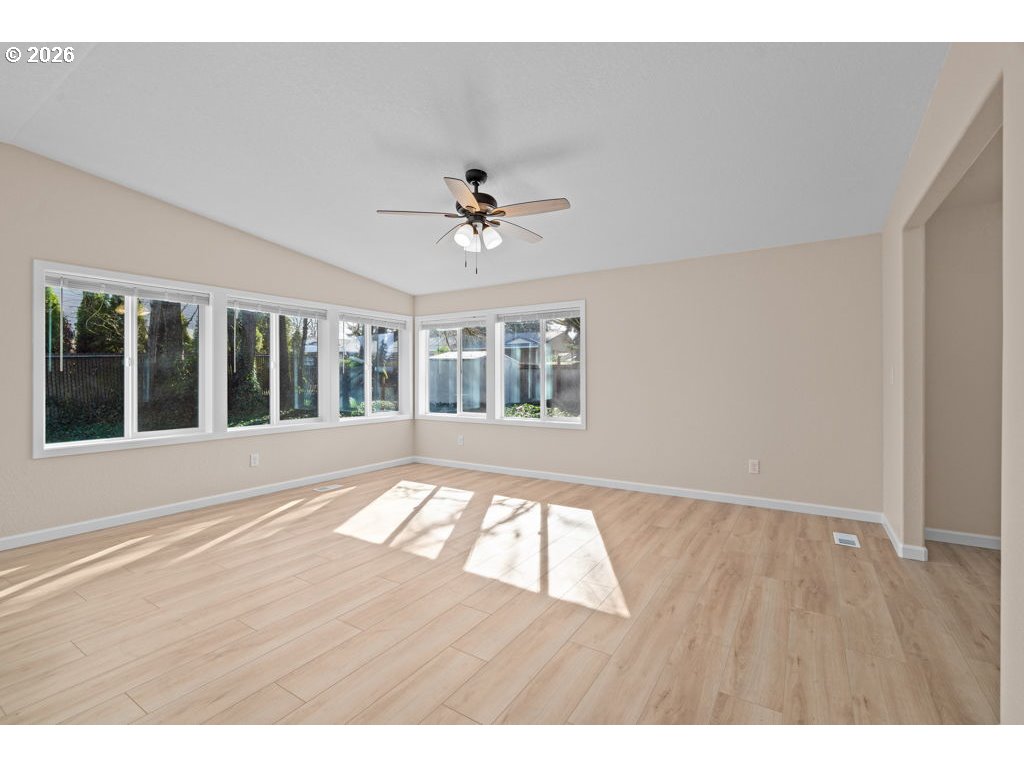 11201 Northwest 3rd Avenue Vancouver, WA 98685 - Photo 5 of 21 a view of an empty room with wooden floor and a window