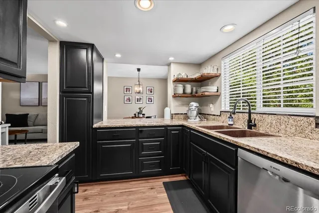 a kitchen with a sink and stove