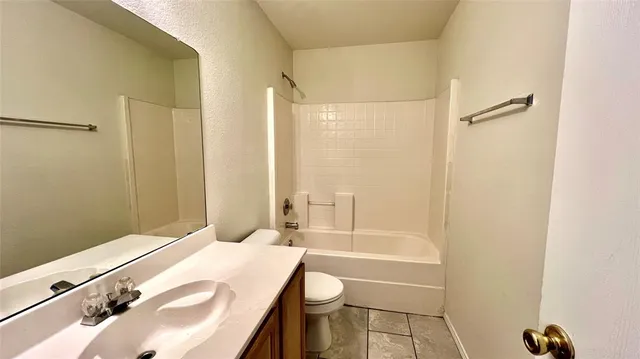 an empty room with wooden floor