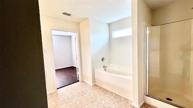 a bathroom with a bathtub and a sink