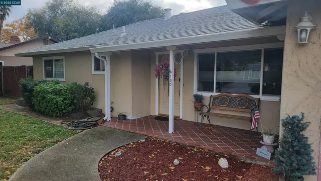 a front view of a house with garden