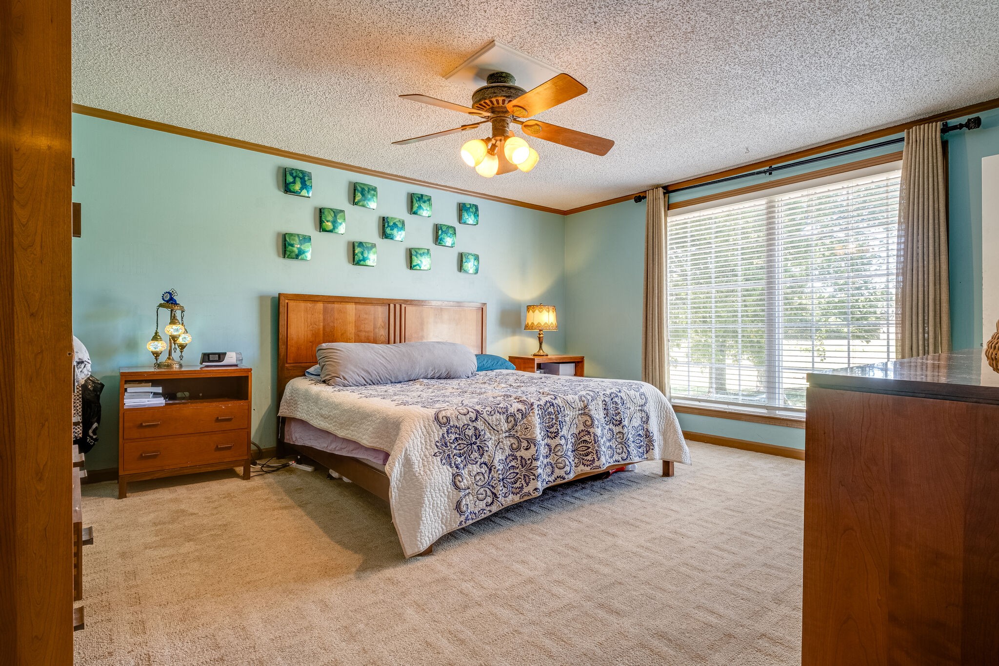 5025 Hickory Ridge Road Lebanon, TN 37087 - Photo 19 of 52 a bedroom with a bed and a chandelier