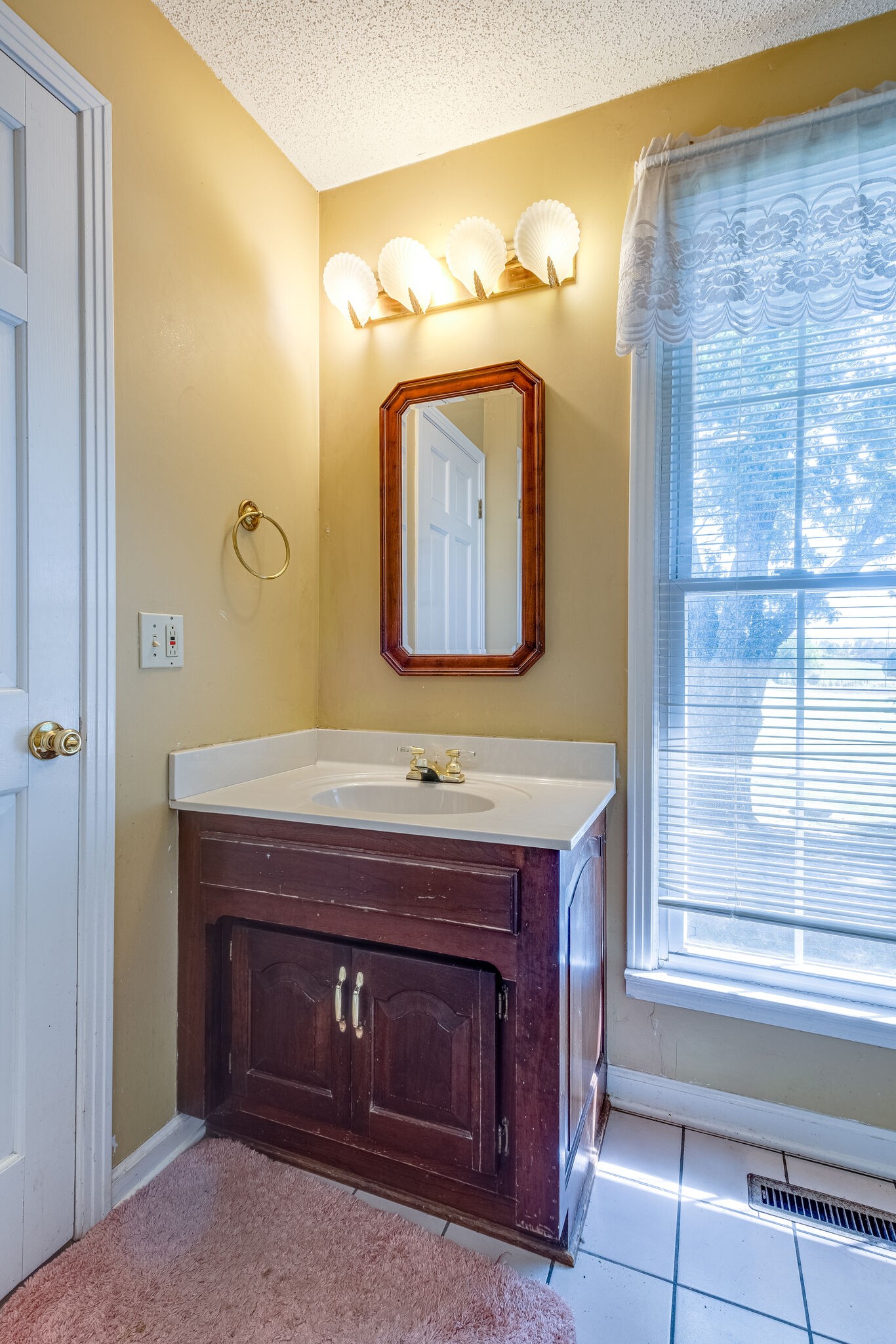 5025 Hickory Ridge Road Lebanon, TN 37087 - Photo 30 of 52 a bathroom with a sink and a mirror