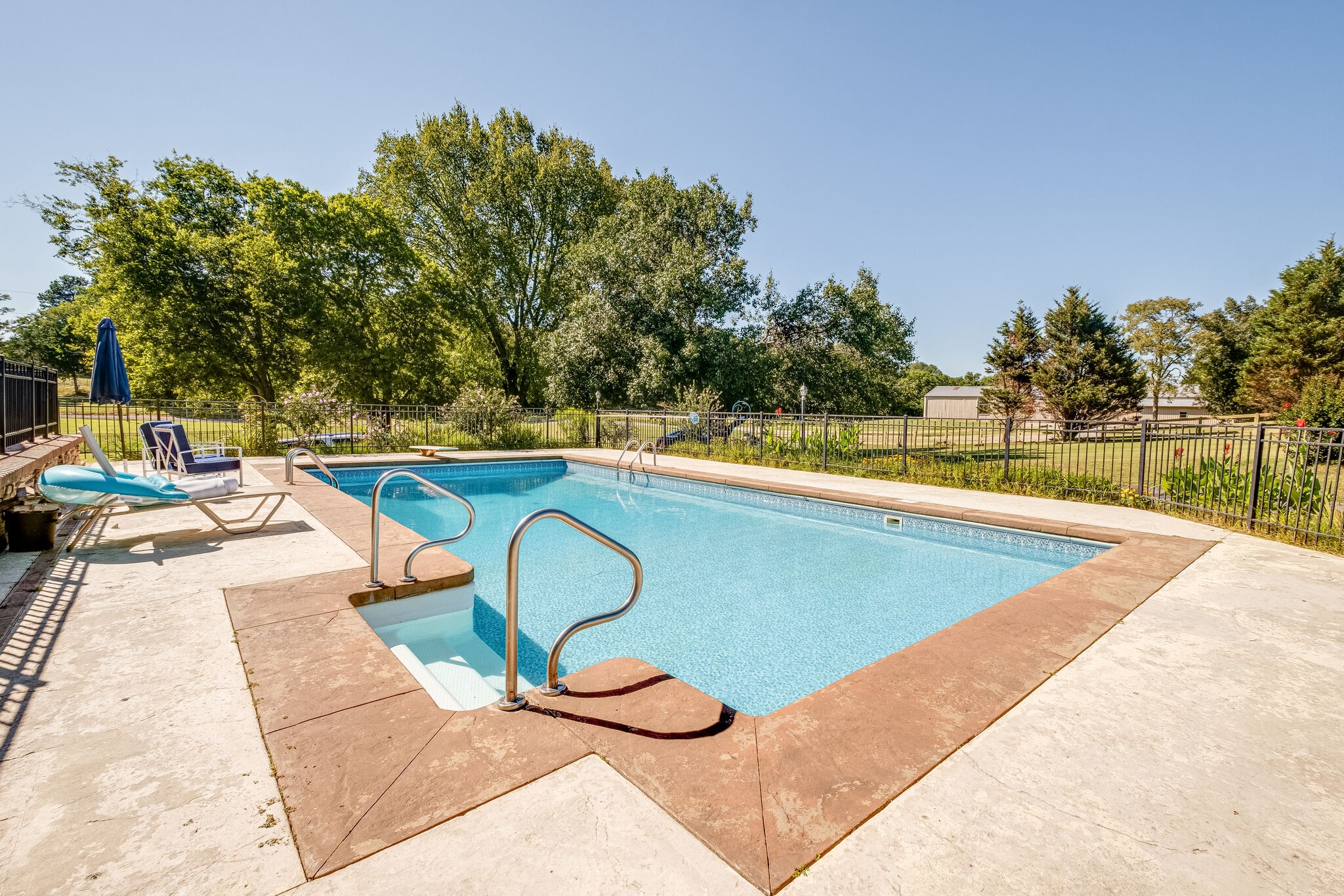 5025 Hickory Ridge Road Lebanon, TN 37087 - Photo 39 of 52 a view of a swimming pool with a lounge chair