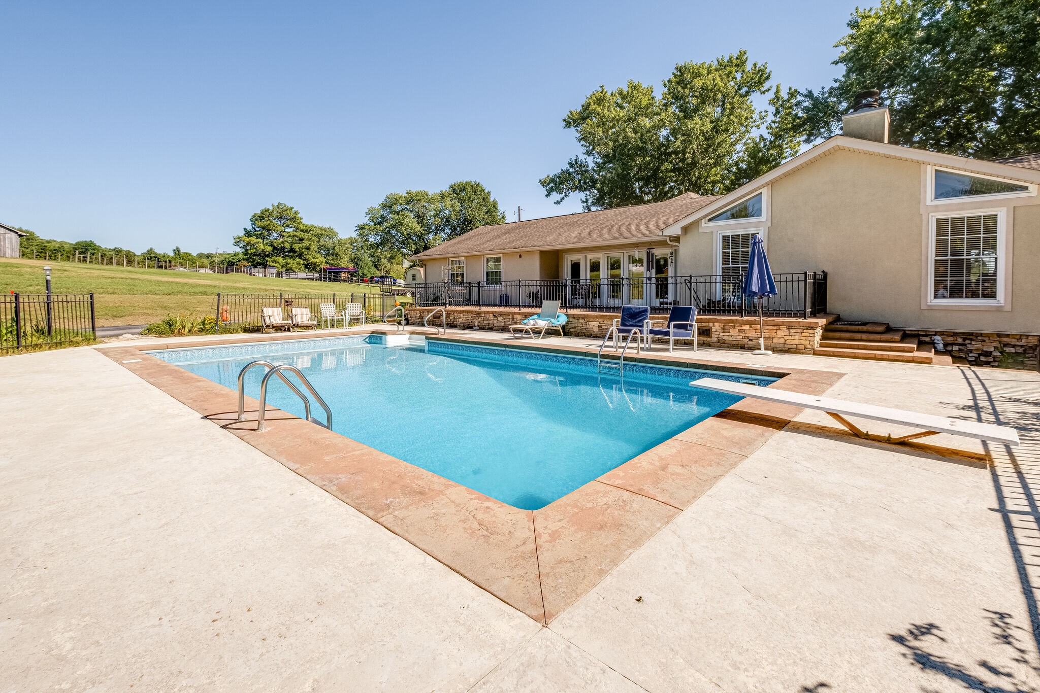 5025 Hickory Ridge Road Lebanon, TN 37087 - Photo 41 of 52 a view of a house with pool and chairs