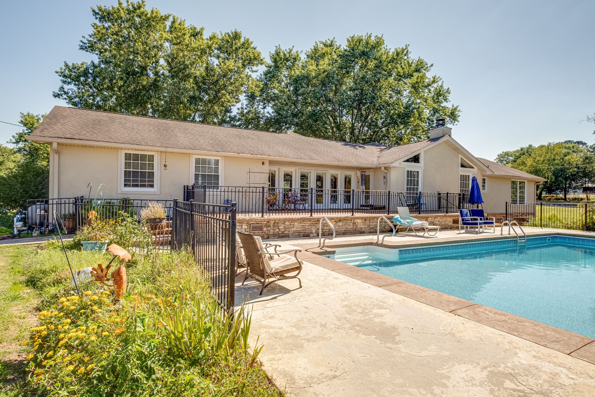 5025 Hickory Ridge Road Lebanon, TN 37087 - Photo 42 of 52 a view of a swimming pool with couches chairs and swimming pool