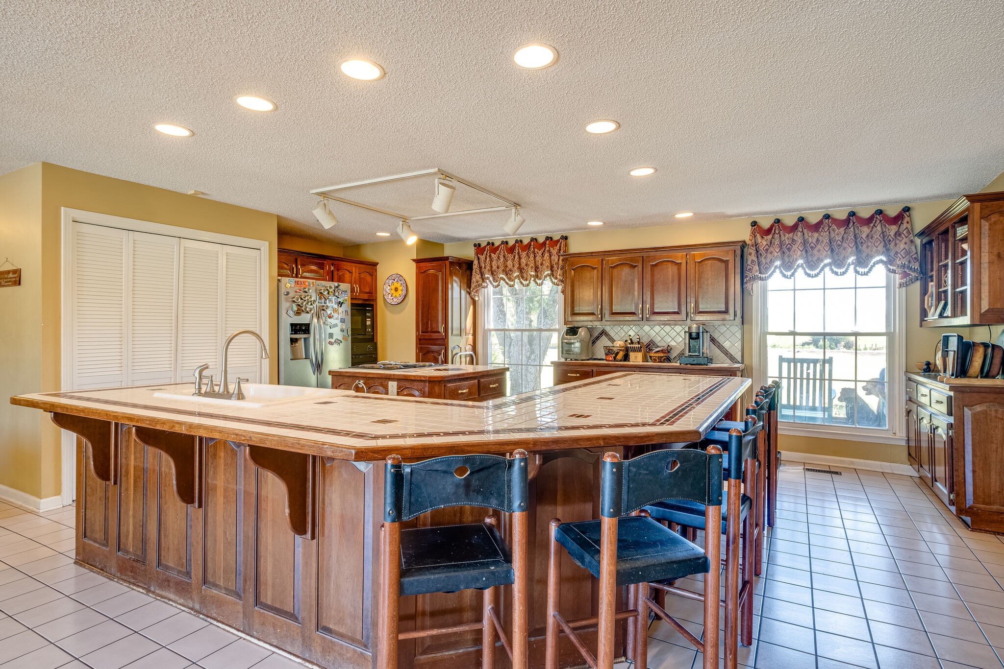 5025 Hickory Ridge Road Lebanon, TN 37087 - Photo 9 of 52 a kitchen with stainless steel appliances granite countertop a kitchen island a sink a stove and a refrigerator