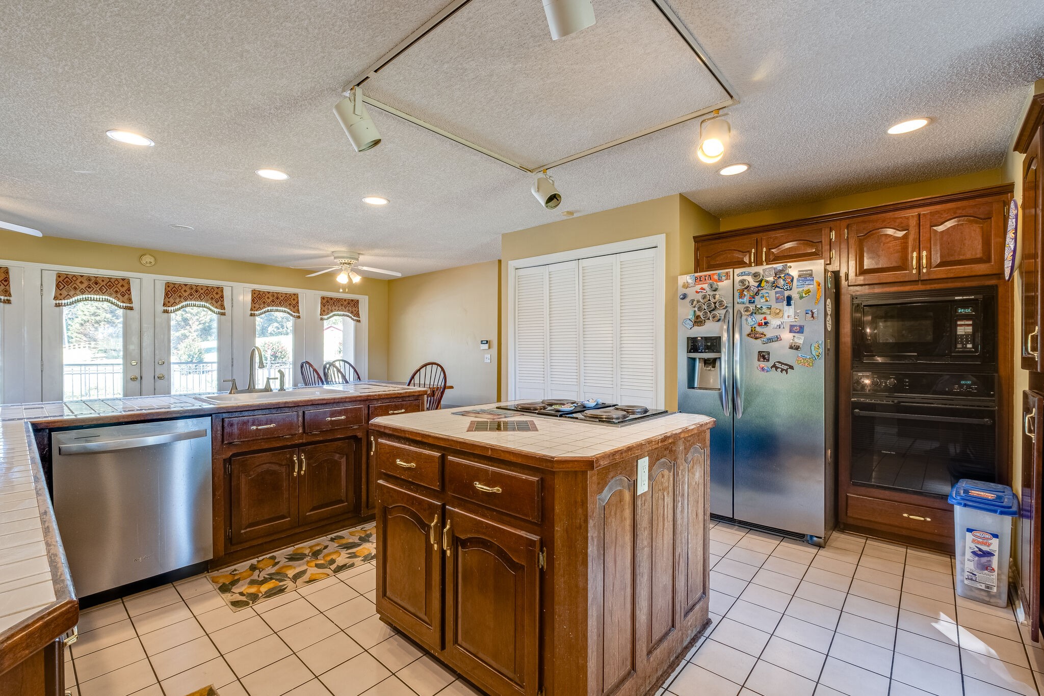 5025 Hickory Ridge Road Lebanon, TN 37087 - Photo 10 of 52 a kitchen with stainless steel appliances granite countertop a stove a sink and a refrigerator