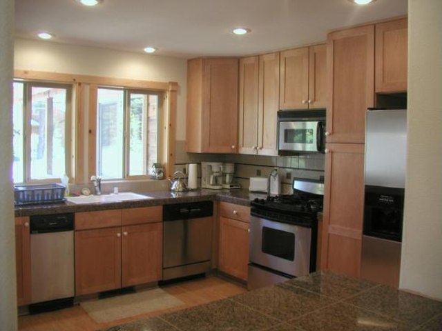 14801 Tyrol Road Truckee, CA 96161 - Photo 3 of 7 a kitchen with stainless steel appliances granite countertop a stove a sink and a microwave