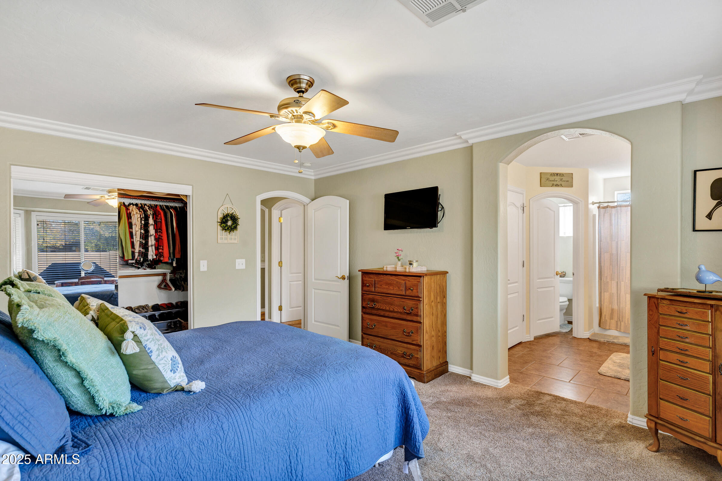 2864 East Pony Court Gilbert, AZ 85295 - Photo 11 of 20 a bedroom with a bed and a chandelier
