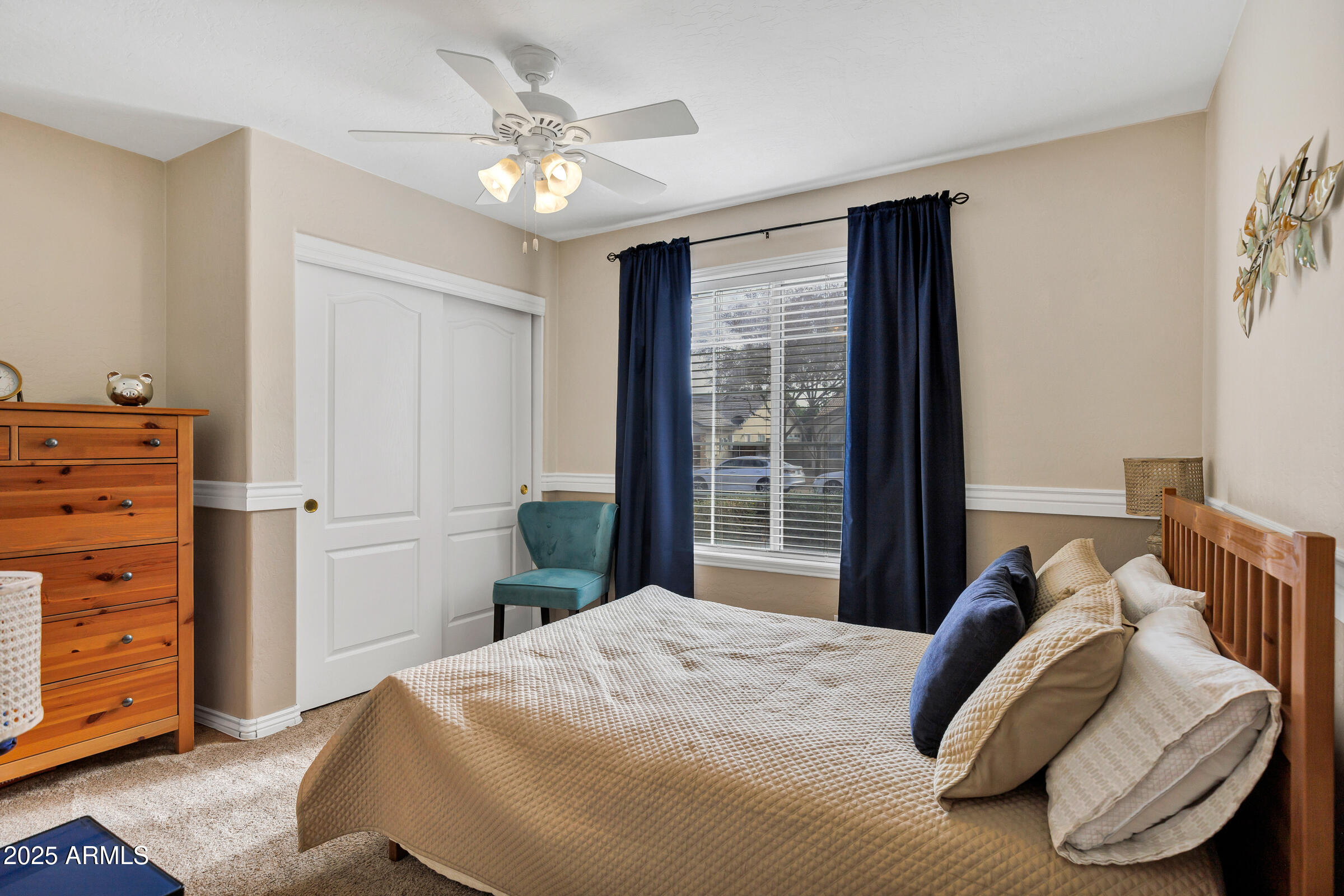 2864 East Pony Court Gilbert, AZ 85295 - Photo 13 of 20 a bedroom with a bed and a chandelier