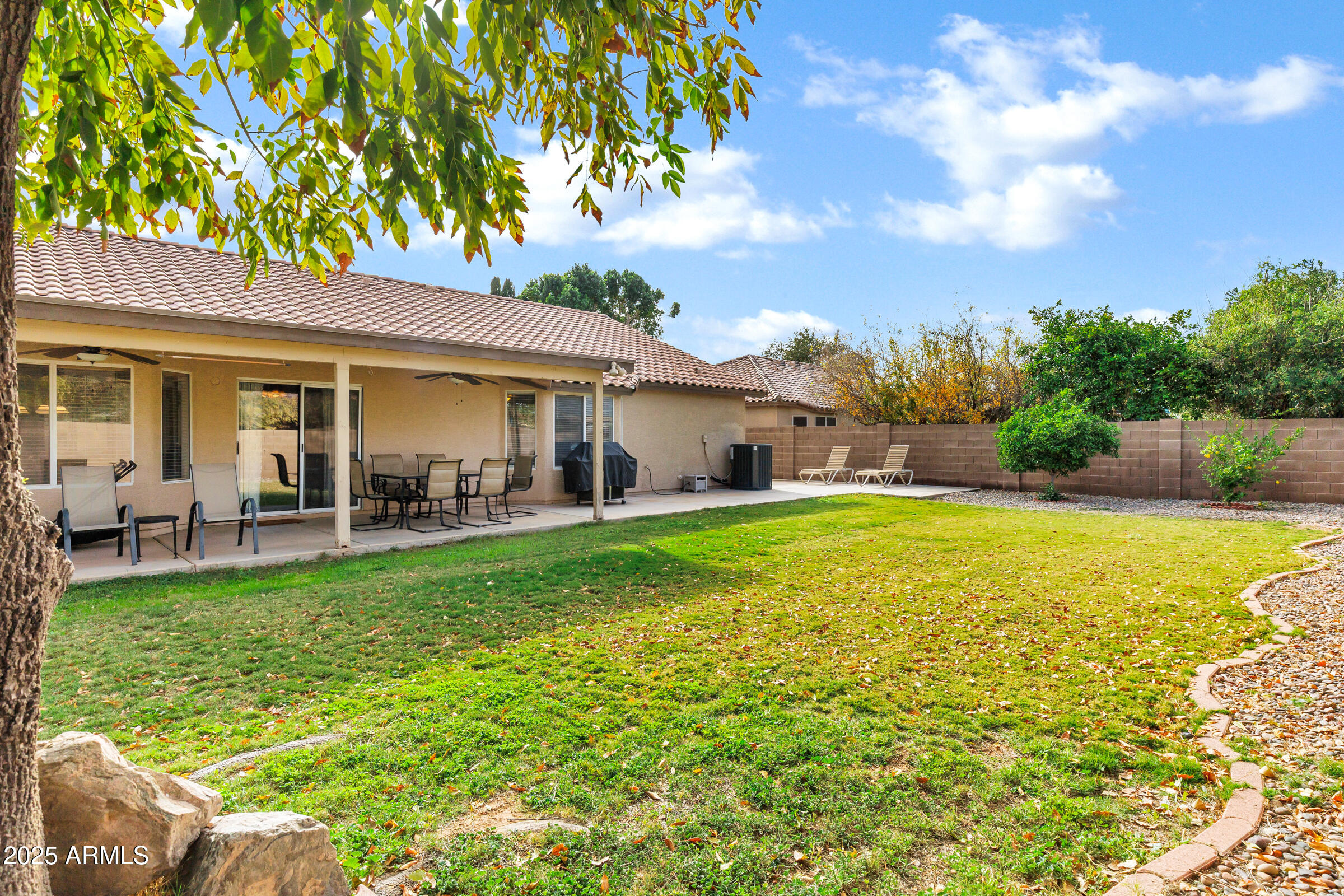 2864 East Pony Court Gilbert, AZ 85295 - Photo 18 of 20 a view of a house with a backyard porch and sitting area