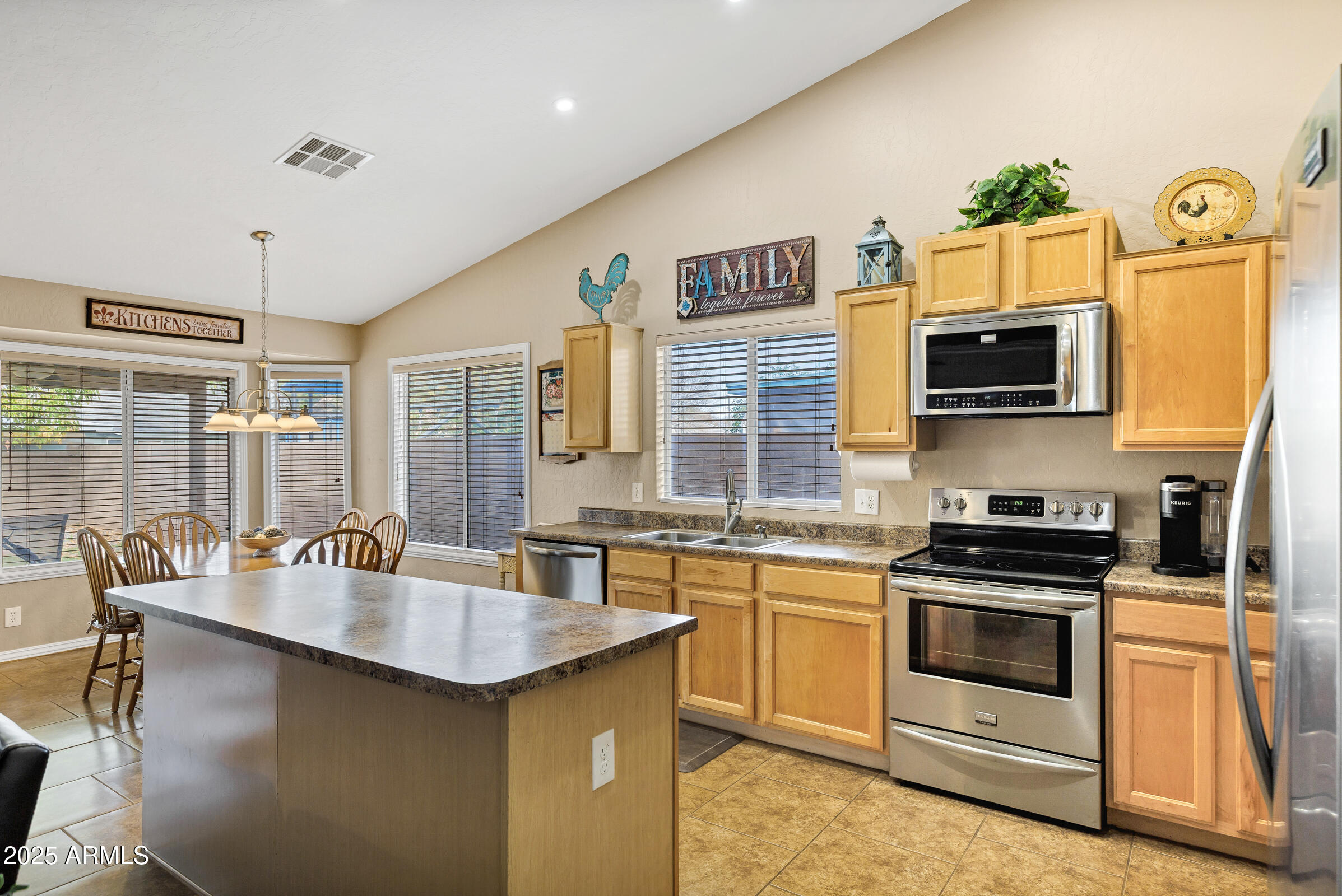 2864 East Pony Court Gilbert, AZ 85295 - Photo 8 of 20 a kitchen with a stove and a sink