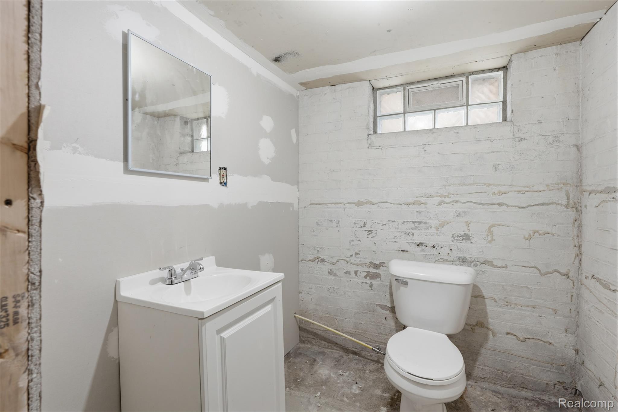 2500 Atkinson Street Detroit, MI 48206 - Photo 19 of 21 Half bath with vanity and concrete flooring