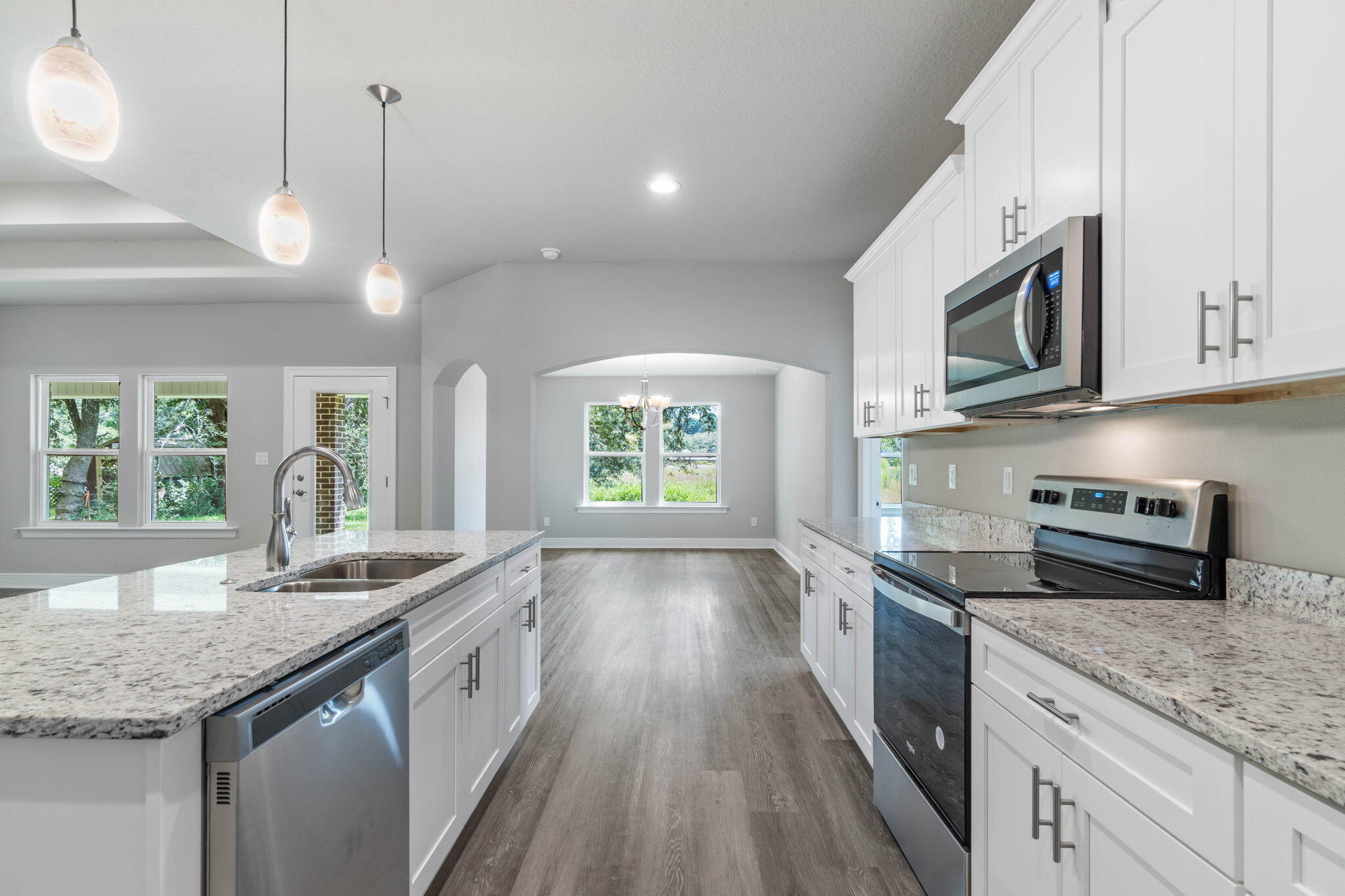 9158 Trident Road Milton, FL 32583 - Photo 15 of 41 a kitchen with stainless steel appliances granite countertop a sink and stove