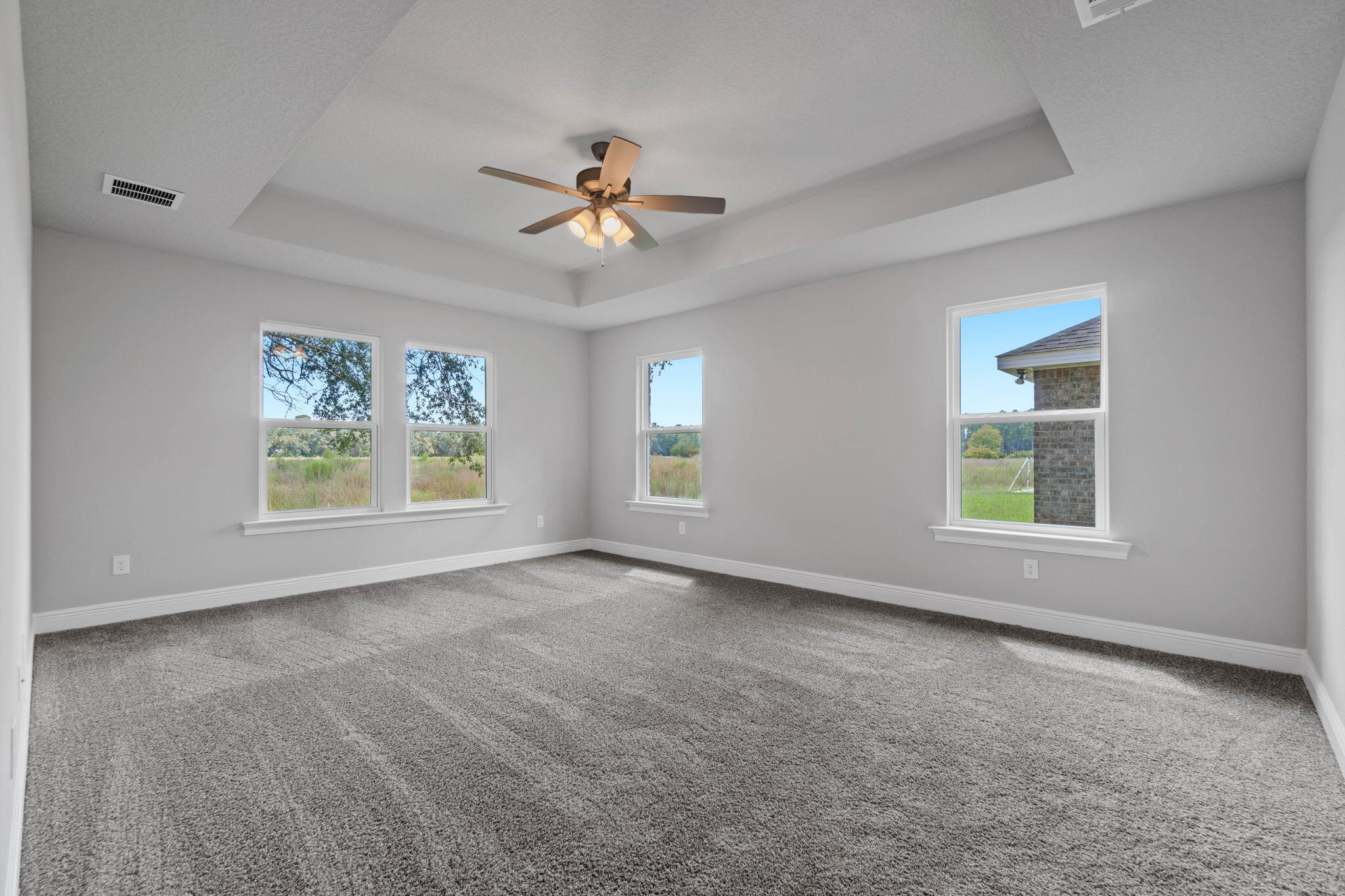 9158 Trident Road Milton, FL 32583 - Photo 20 of 41 a view of an empty room with a window