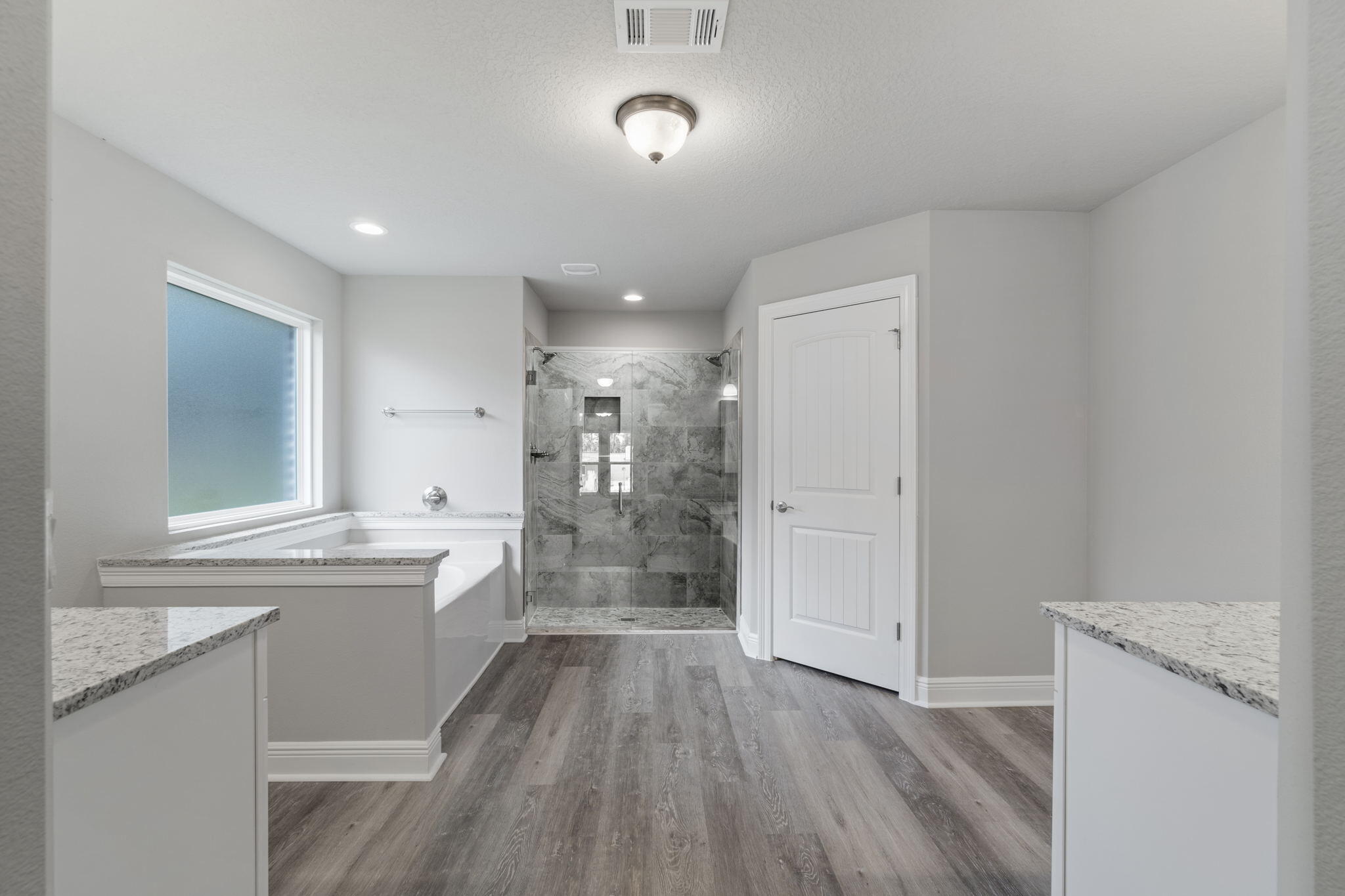 9158 Trident Road Milton, FL 32583 - Photo 24 of 41 a bathroom with a sink a mirror and a bathtub