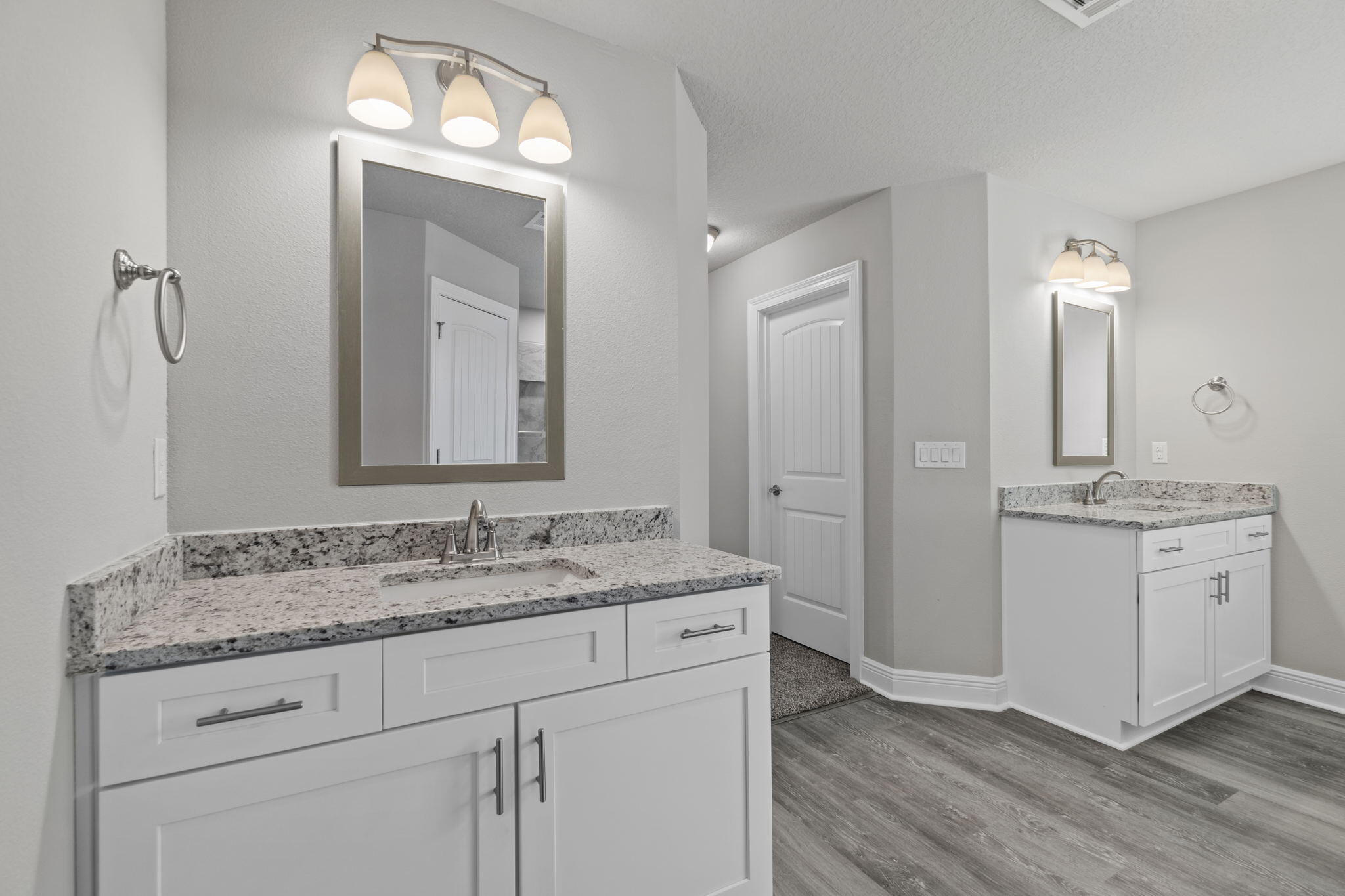 9158 Trident Road Milton, FL 32583 - Photo 26 of 41 a bathroom with a granite countertop sink vanity and mirror