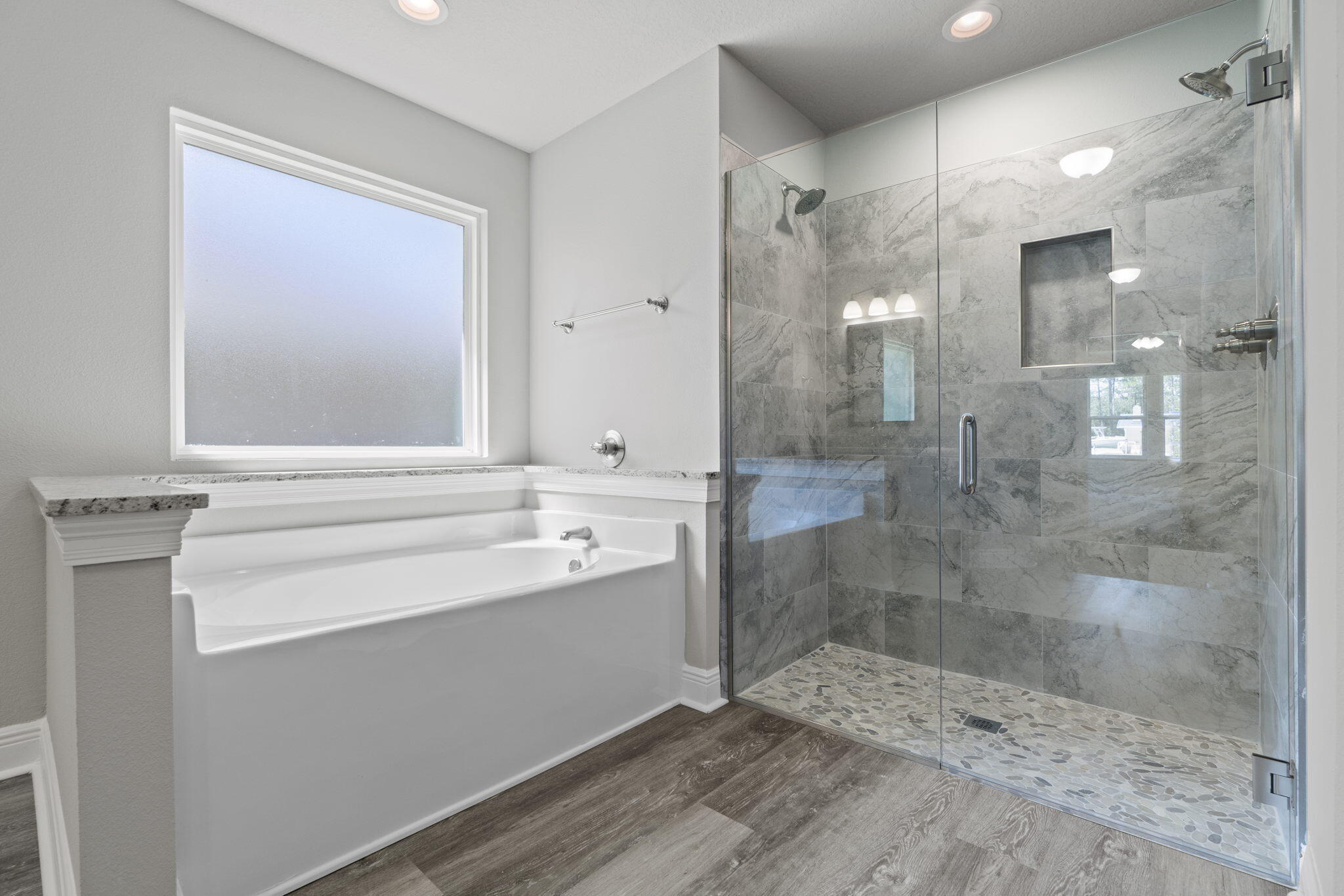 9158 Trident Road Milton, FL 32583 - Photo 27 of 41 a bathroom with a shower sink and mirror