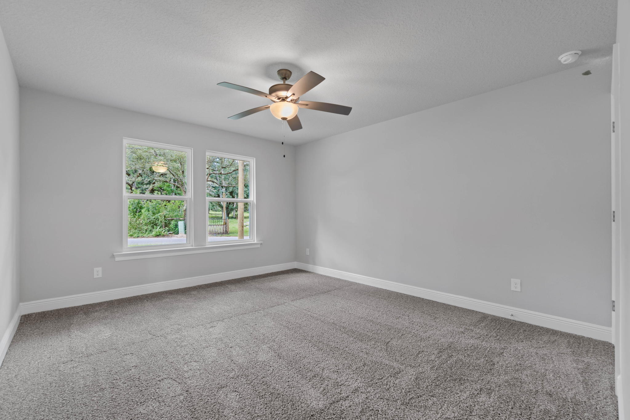 9158 Trident Road Milton, FL 32583 - Photo 29 of 41 a view of room with a ceiling fan and window