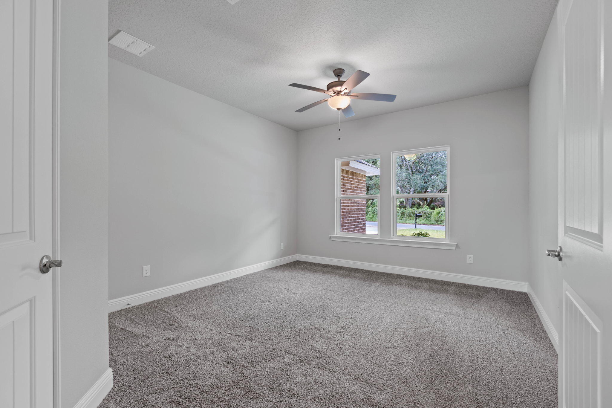 9158 Trident Road Milton, FL 32583 - Photo 34 of 41 a view of room with a ceiling fan and window