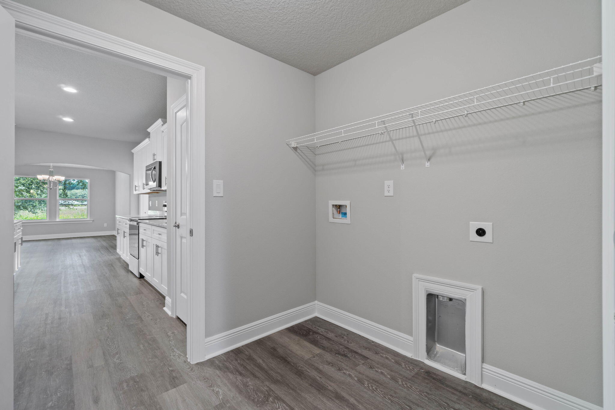 9158 Trident Road Milton, FL 32583 - Photo 36 of 41 wooden floor in an empty room with a window
