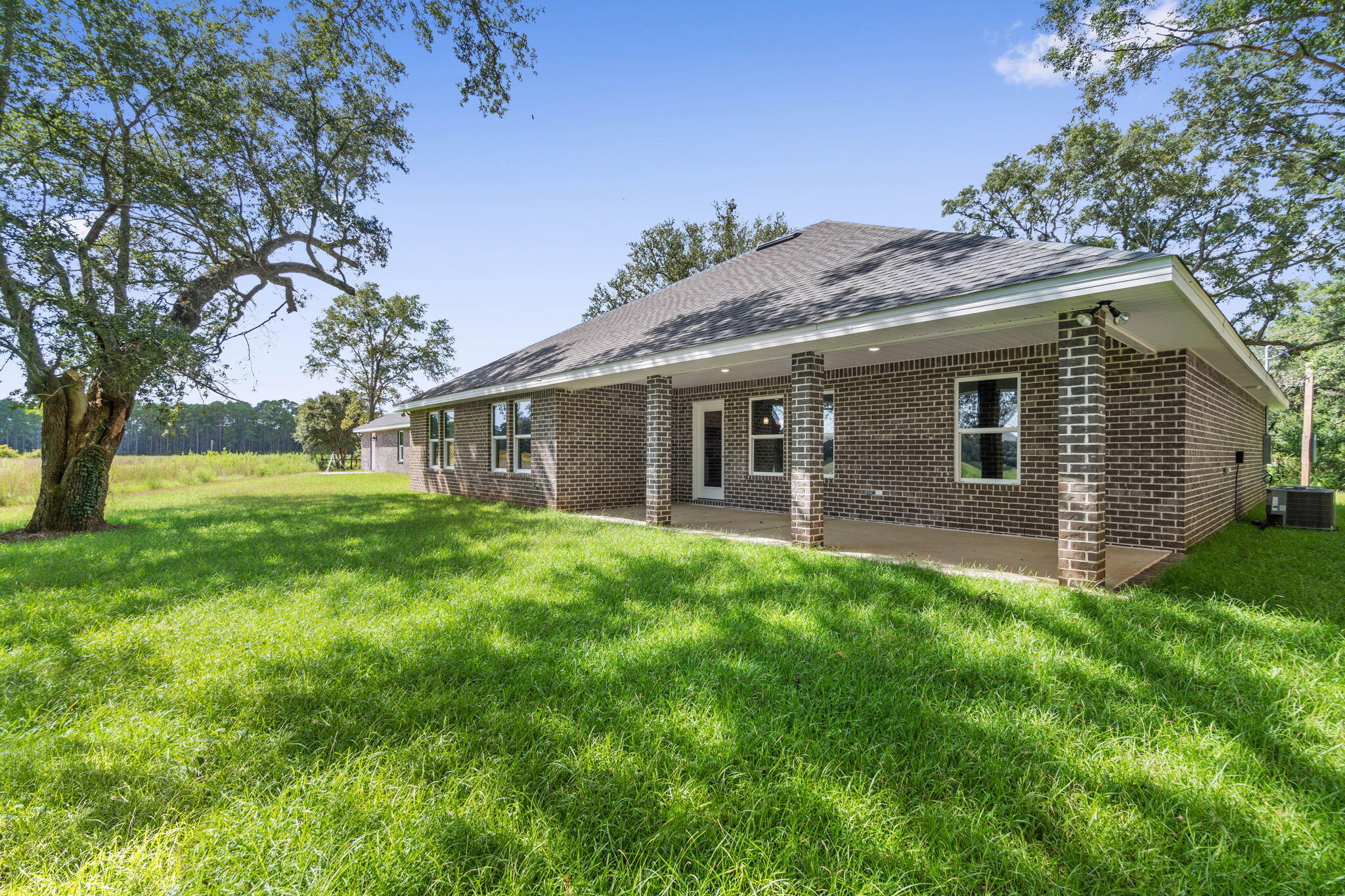 9158 Trident Road Milton, FL 32583 - Photo 39 of 41 a front view of house with yard and green space