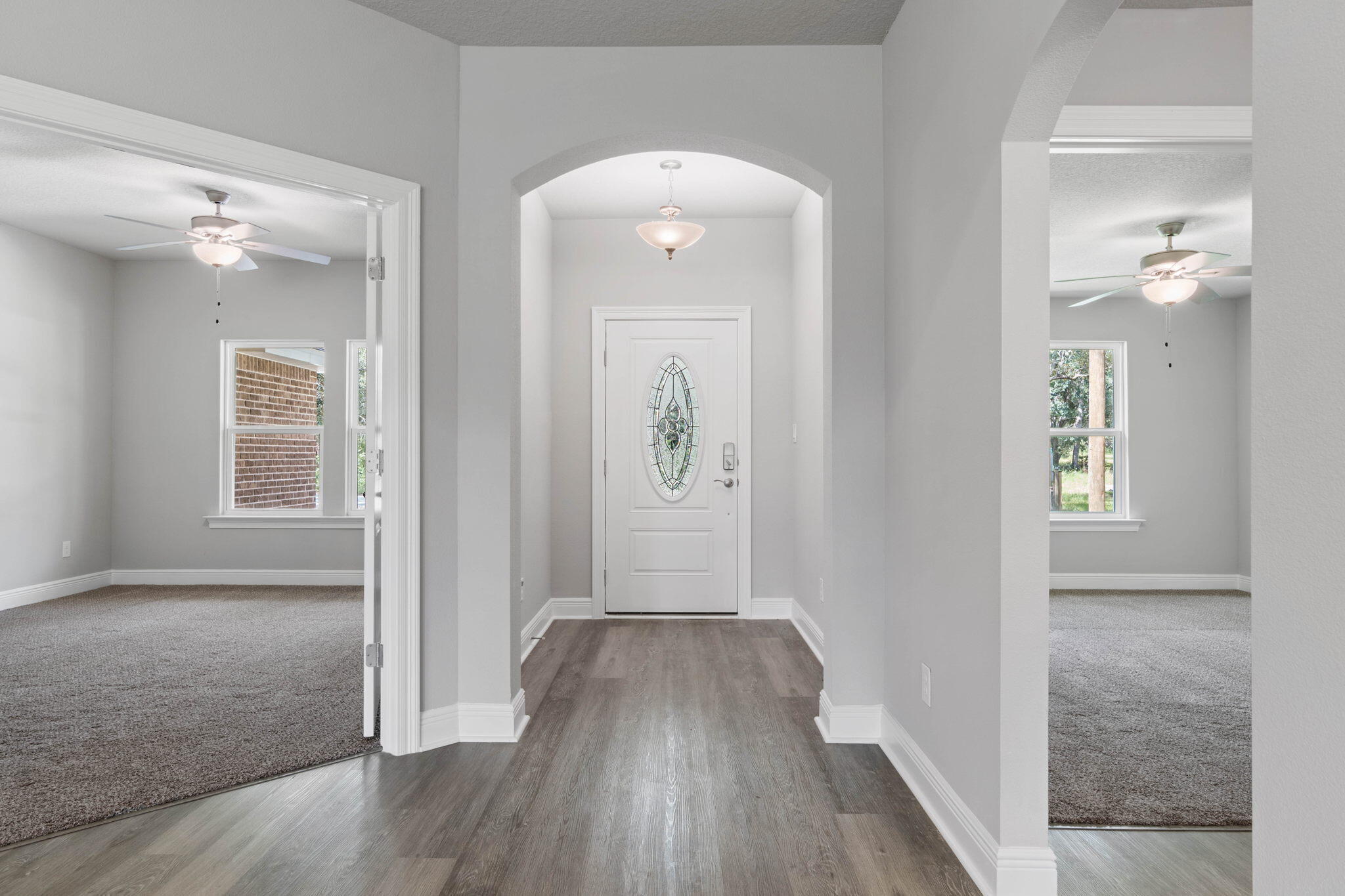 9158 Trident Road Milton, FL 32583 - Photo 7 of 41 wooden floor in a hall with a window