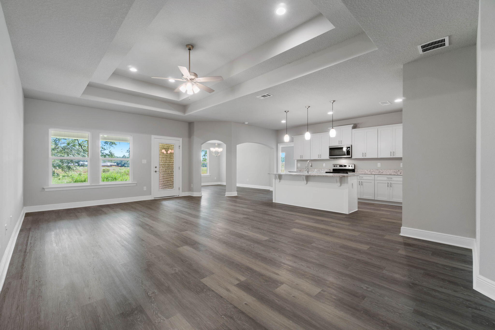 9158 Trident Road Milton, FL 32583 - Photo 8 of 41 a view of kitchen with sink and wooden floor