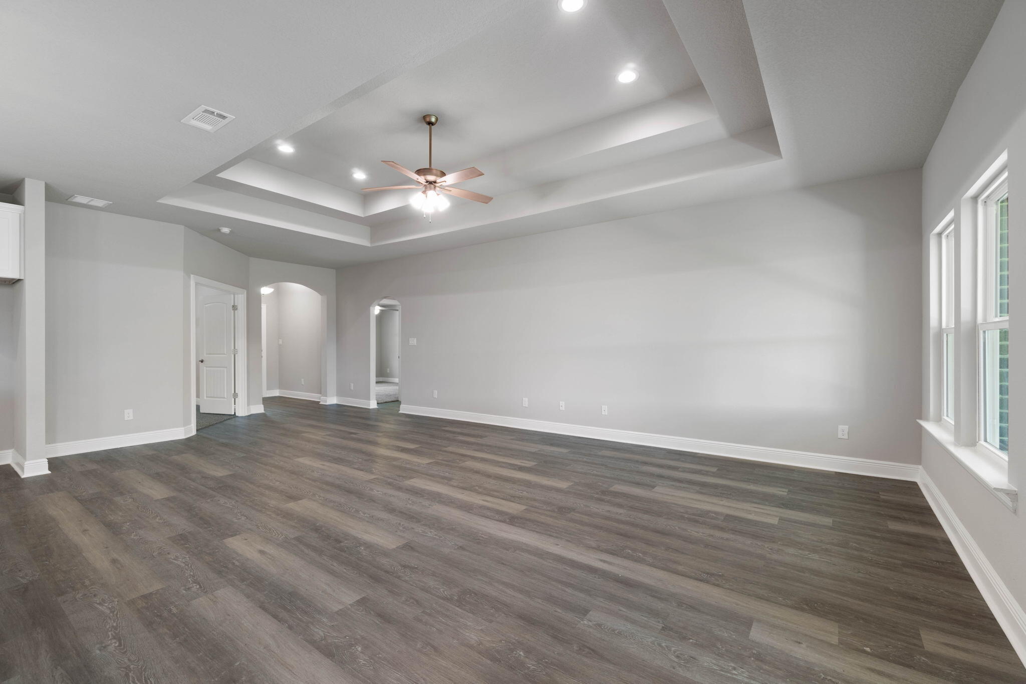 9158 Trident Road Milton, FL 32583 - Photo 10 of 41 an empty room with wooden floor and window