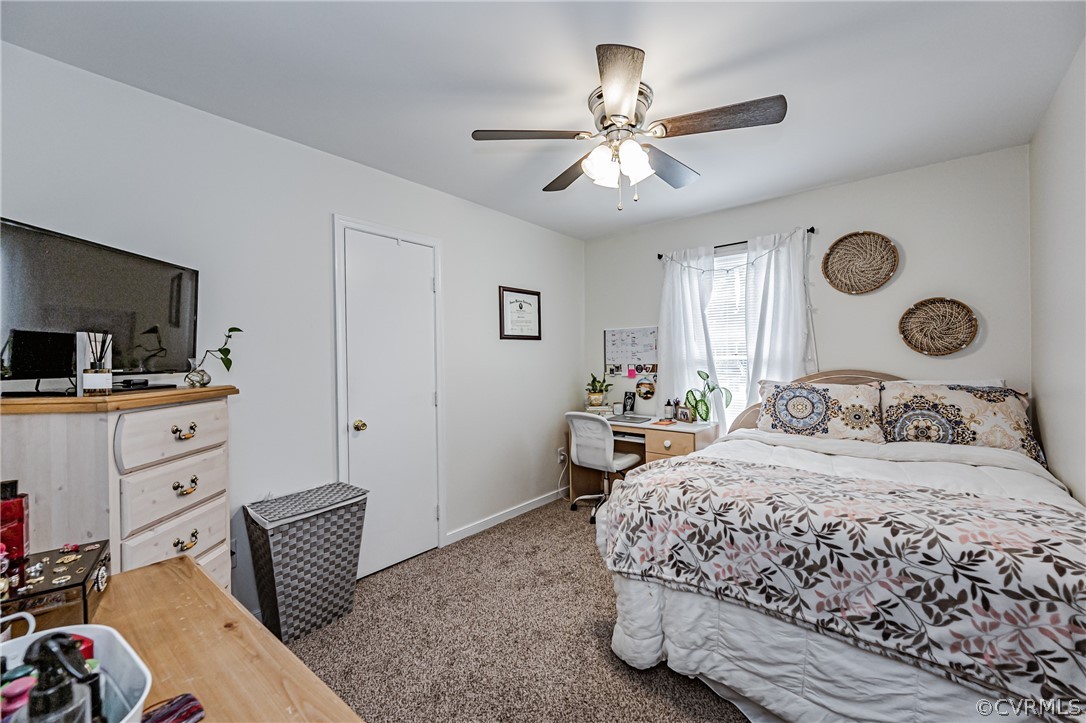 3902 Echo Ridge Court Midlothian, VA 23112 - Photo 11 of 42 a bedroom with a bed and a chandelier