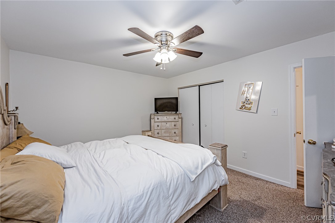 3902 Echo Ridge Court Midlothian, VA 23112 - Photo 15 of 42 a bedroom with a bed and a ceiling fan