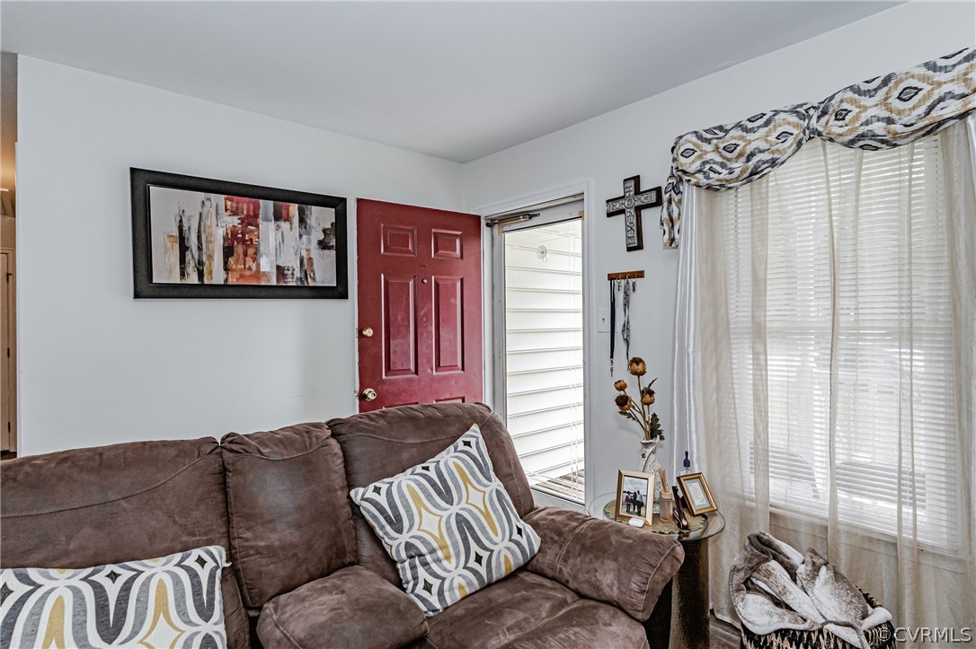 3902 Echo Ridge Court Midlothian, VA 23112 - Photo 24 of 42 a living room with furniture and a large window
