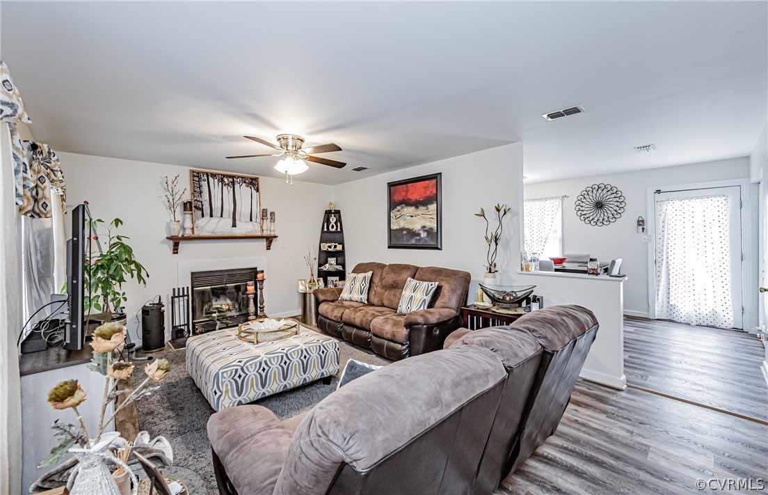 3902 Echo Ridge Court Midlothian, VA 23112 - Photo 25 of 42 a living room with furniture and a fireplace