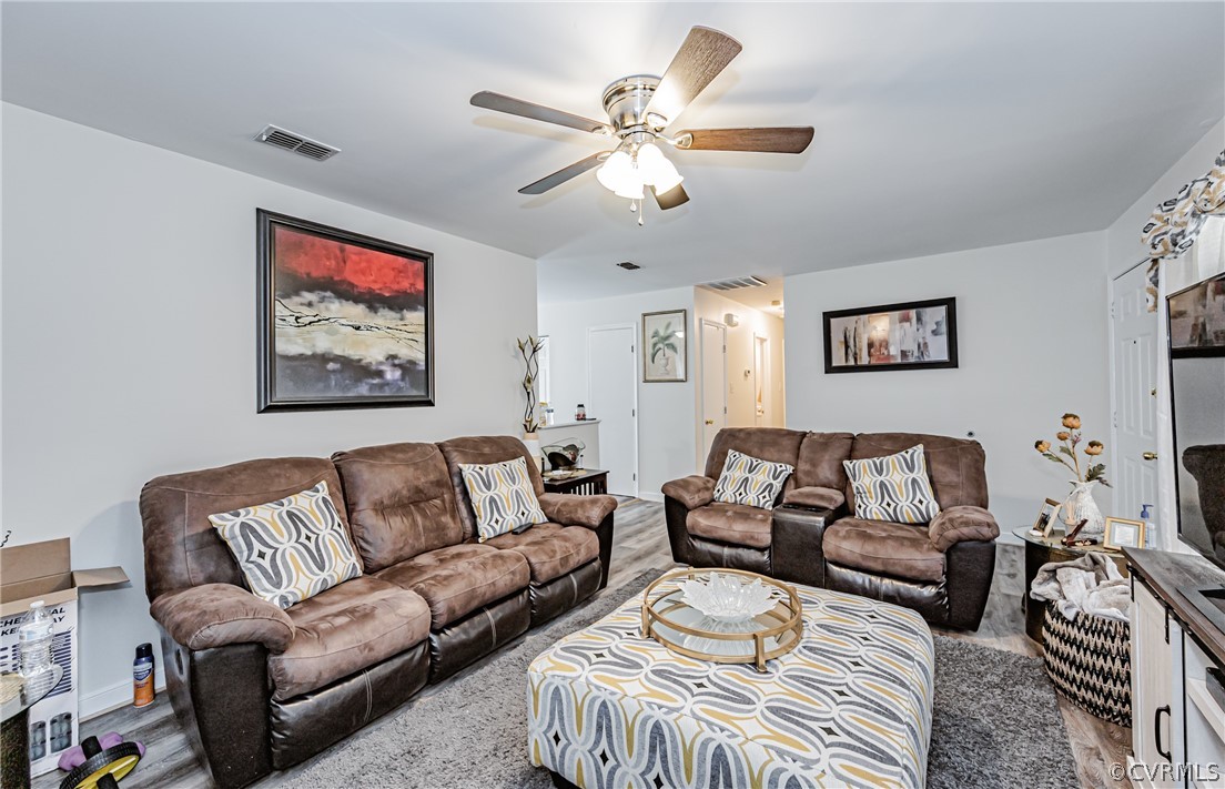 3902 Echo Ridge Court Midlothian, VA 23112 - Photo 28 of 42 a living room with furniture and a chandelier
