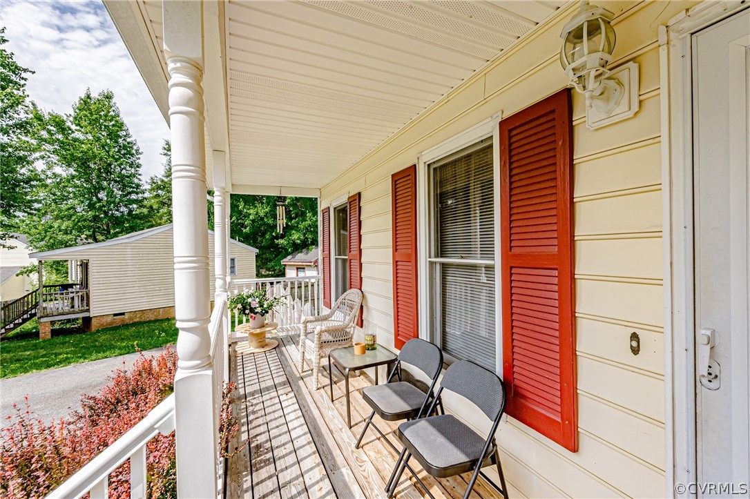 3902 Echo Ridge Court Midlothian, VA 23112 - Photo 3 of 42 a view of a patio with table and chairs and wooden fence