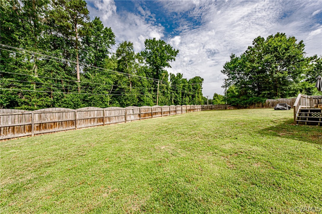 3902 Echo Ridge Court Midlothian, VA 23112 - Photo 41 of 42 a view of a green yard with wooden fence