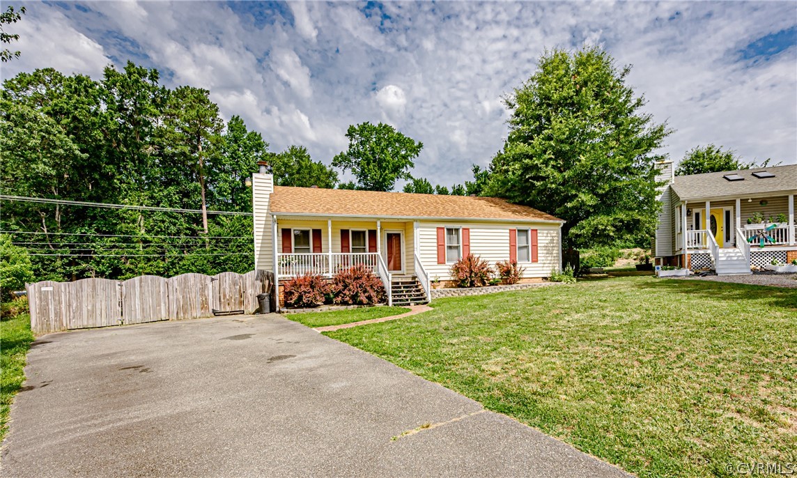 3902 Echo Ridge Court Midlothian, VA 23112 - Photo 5 of 42 a front view of a house with a yard and trees