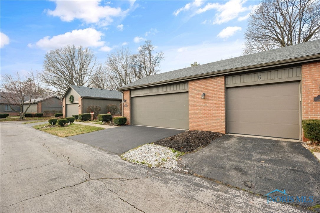 3 Abbey Road Perrysburg, OH 43551 - Photo 2 of 37 Two-car garage with accessible ramp.