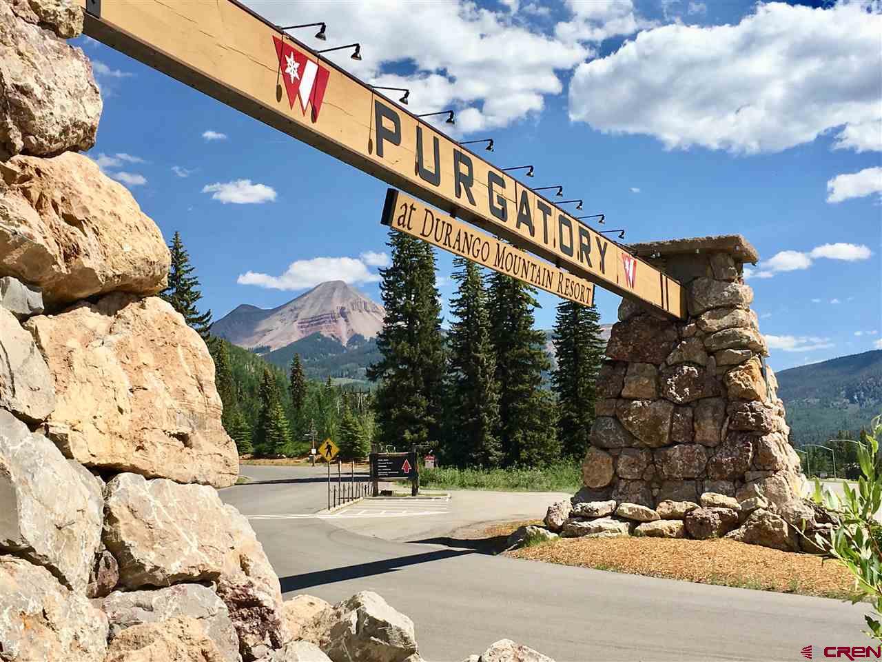 245 Sultan (lot 82) Drive Durango, CO 81301 - Photo 16 of 31 a backyard of a house with table and chairs