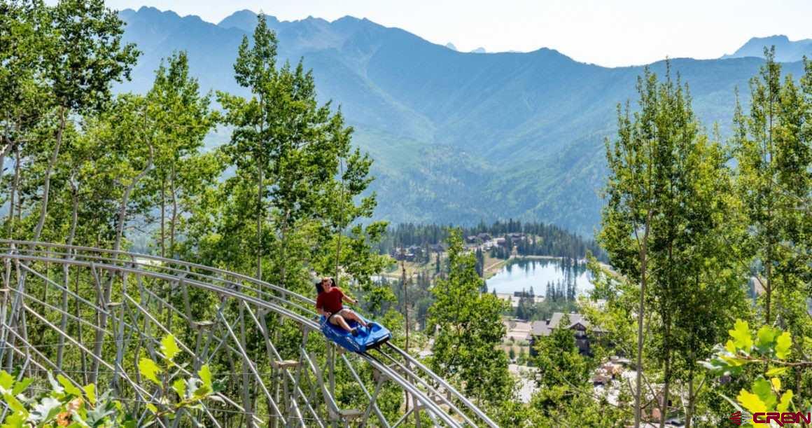 245 Sultan (lot 82) Drive Durango, CO 81301 - Photo 28 of 31 an aerial view of a house with a yard and garden
