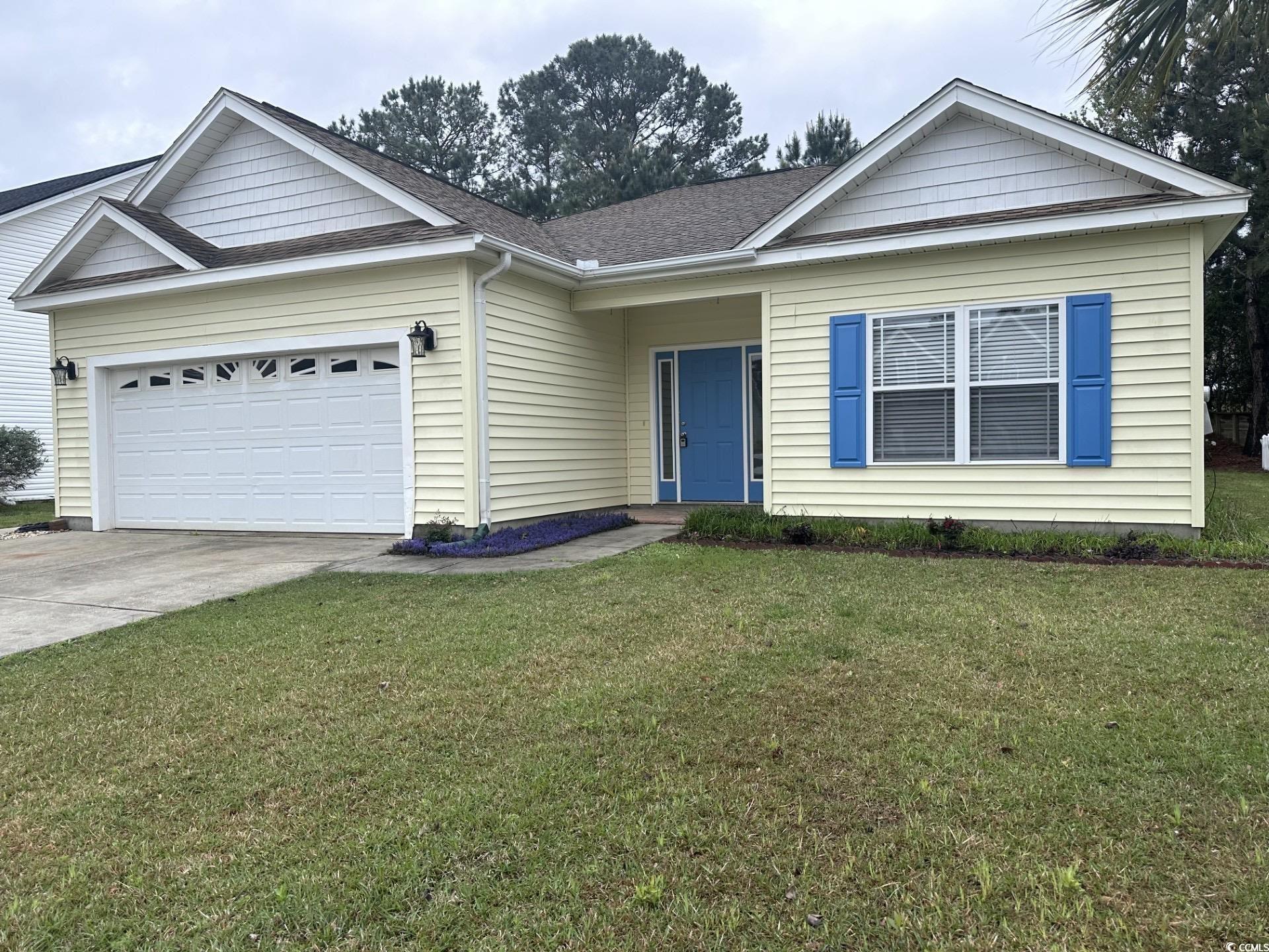 160 Molinia Drive Murrells Inlet, SC 29576 - Photo 2 of 7 Ranch-style home with a front yard, a shingled roof, concrete driveway, and an attached garage