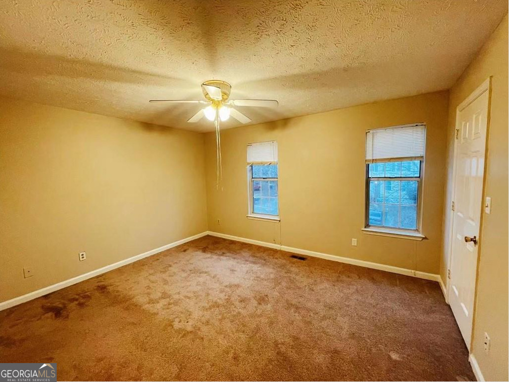 1857 Grant Court Kennesaw, GA 30144 - Photo 11 of 14 a view of an empty room with a window