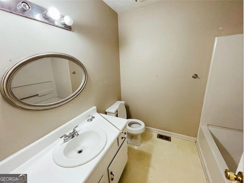 1857 Grant Court Kennesaw, GA 30144 - Photo 12 of 14 a bathroom with a sink and a mirror