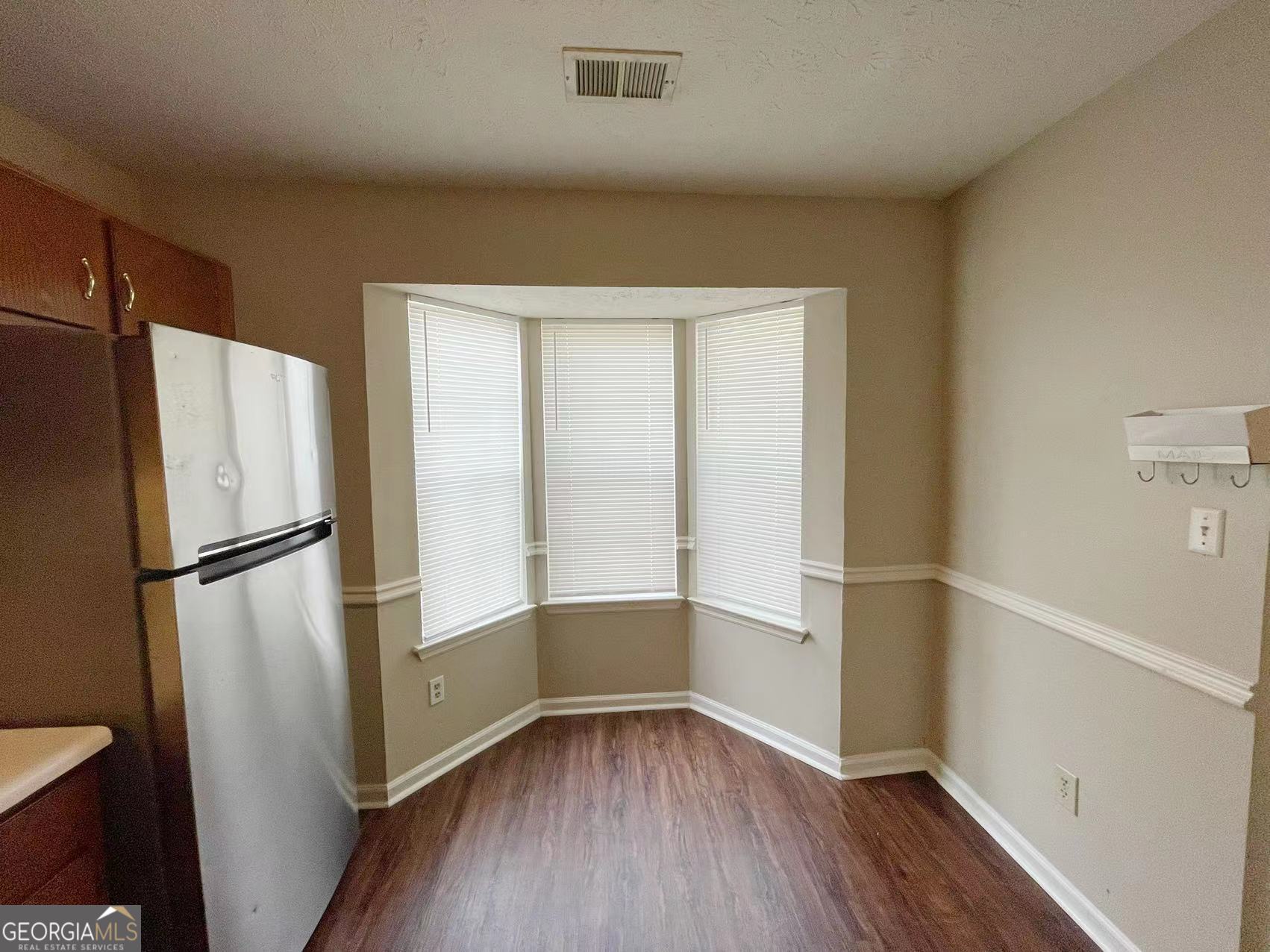 1857 Grant Court Kennesaw, GA 30144 - Photo 6 of 14 a view of walk in closet with wooden floor