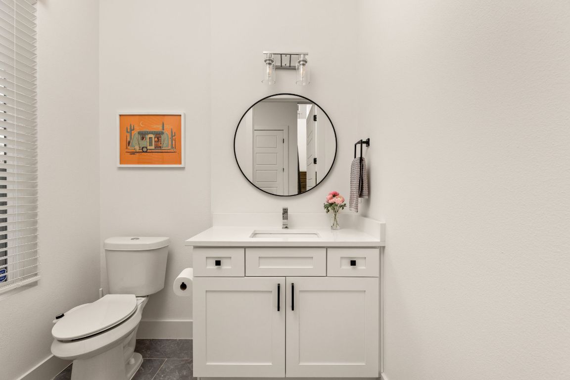 5109 Glissman Road, Unit 1 Austin, TX 78702 - Photo 15 of 39 Bathroom featuring vanity and dark tile patterned flooring