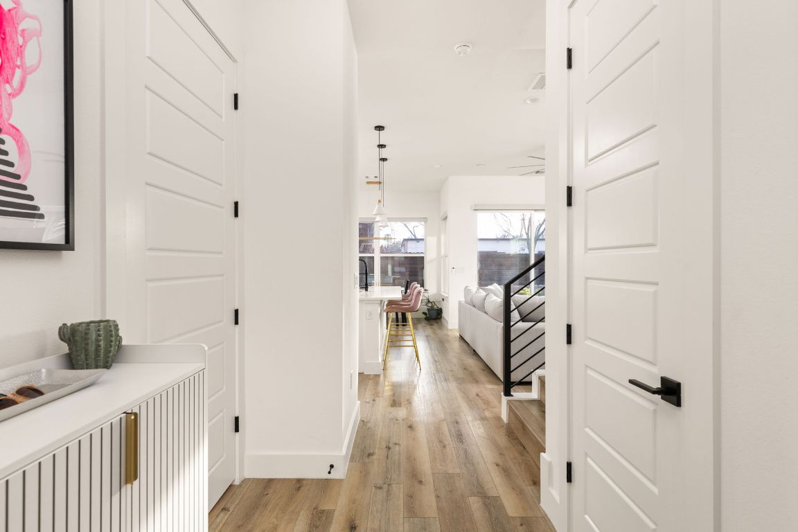 5109 Glissman Road, Unit 1 Austin, TX 78702 - Photo 4 of 39 Hallway with light wood finished floors and baseboards
