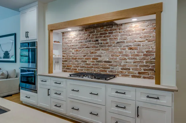 a shelf with books and knick knacks on it