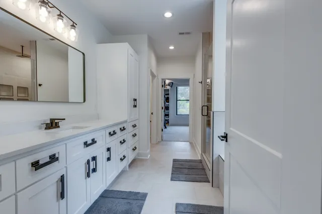 a view of a field with a tree in the background