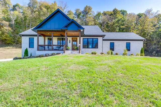 a porch with outdoor seating
